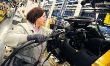 A worker assembles vehicles at PSA's factory in Rennes, France, where the automaker produces the mid-sized Peugeot 508 and Citroen C5.